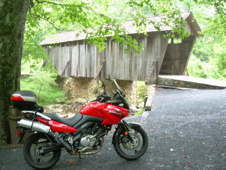 motorcycle at covered bridge